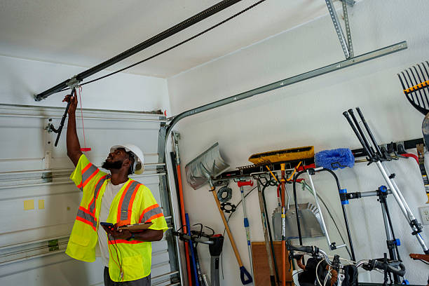 Professional Garage Door Panel Replacement technician working in West Ishpeming, MI